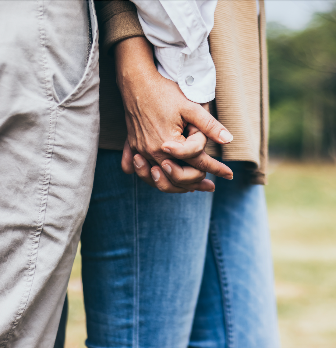 close up of a couple holding hands